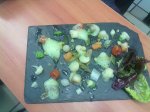 Ensalada de verduras confitadas y aire de guisante